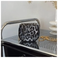 Detail of grey leopard print crossbody bag with gold chain strap and animal texture - Black