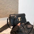 Retro black crossbody bag with polished leather finish and golden statement clasp - Black