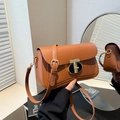 Brown leather underarm bag with gold T-shaped clasp and adjustable shoulder strap - Brown