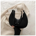 Close-up of black matte leather hobo bag with silver buckle and minimalist wide strap - Black