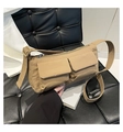 Multi-pocket khaki nylon crossbody bag with adjustable strap on leather background - Brown
