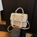 White glossy faux leather handbag with FASHION text and metal buckle accents - With Pendant / White