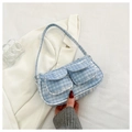 Detail of light blue corduroy handbag with dual front pockets and soft ribbed texture - Blue