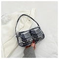 Detail of a vintage black and white checkered tweed handbag with two front pockets - Gray