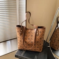 Brown tote bag with vintage monogram print and durable leather handles in a chic setting - Brown (Style 1)