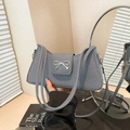 Gray textured fabric shoulder bag with a silver metal bow accent in a minimalist style - Black
