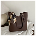 Detail of deep brown tote bag featuring white contrast stitching and a patterned silk scarf - Dark Brown