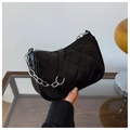 Detail of black quilted crescent bag with silver chain and matte PU leather texture - Black