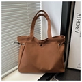 Detailed view of brown tote bag with drawstring sides and secure snap button pocket - No Pendant / Brown