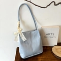 Light blue tote bag with lace bow decoration and unique textured pleated surface - Blue