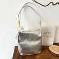 Silver metallic textured tote bag featuring white lace bow and slim shoulder straps - Silver