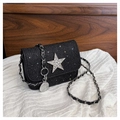 Detail of black sequined crossbody bag with silver rhinestone star and chain strap - Black