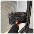 Detail of leopard print small square bag with silver chain strap and metal rivets - Black