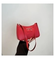 Red baguette underarm bag with silver metal bow and matte leather finish for women - Red