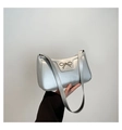 Fashionable metallic silver baguette shoulder bag with a metal bow accent for women - Silver