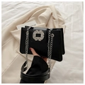Black leather shoulder bag with a luxurious crystal buckle and silver chain strap - Black