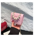 Pink heart embossed mini crossbody bag with pearl handle and golden chain detail - Pink