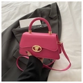 Detail of fuchsia handbag with elegant gold clasp and textured synthetic leather surface - Rose Pink