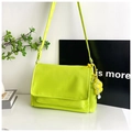 Detail showing fluorescent yellow nylon bag with flap closure and cute flower charm - Green (With Pendant)