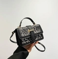 Detail of leopard print crossbody bag with black leather trim and gold metal hardware - Black