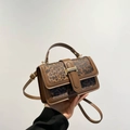 Detail of vintage leopard print crossbody bag with leather trim and gold buckle - Brown