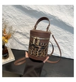 Detail of leopard print bucket bag featuring double zippers and dark brown leather straps - Leopard Coffee