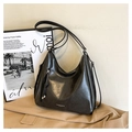Minimalist black hobo shoulder bag with oil wax finish and zipper detail in a retro style - Black
