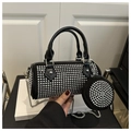 Detail of black cylinder handbag with silver studs, chain strap and small round pouch - Black