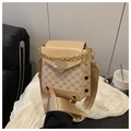 Detail of retro monogram crossbody bag with golden heart clasp and wide shoulder strap - Khaki