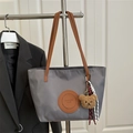 Waterproof grey nylon tote bag with brown leather straps and plush bear keychain charm - Large / With Pendant / Dark Gray