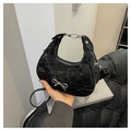 Elegant black hobo bag with pleated leather texture and silver bow buckle detail - Black