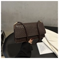 Close-up of the woven texture on this retro brown crossbody bag with a slim strap - Dark Brown