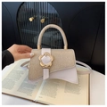 Beige crossbody handbag with woven texture, leather details and a golden flower buckle - Gold
