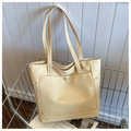 Minimalistische cremegelbe Canvas-Tragetasche mit Schultergurten und Fronttasche - Khaki