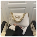 Detail of white PU leather bag with golden bow hardware and chunky metal chain straps - White