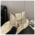 Detail of the woven texture and golden square buckle on this creamy white shoulder bag - White
