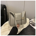 Detail of silver woven shoulder bag featuring textured faux leather and gold metal buckle - Gray