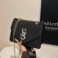 Sparkly black sequin crossbody bag with gold S logo and tassel chain strap - Black