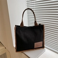 Minimalist black corduroy tote bag with brown straps and stylish fashion bag patch - Black