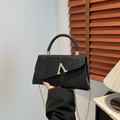 Chic black square bag with matte leather, sequins, and a gold metal V logo accent - Black