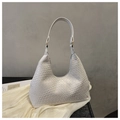 Detail showing the white woven texture and golden round hardware on the chic hobo shoulder bag - White