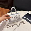 Silver mini handbag with bow clasp, metallic texture and detachable chain strap - Silver