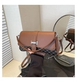 Detail shot of vintage brown monogram underarm bag with silver buckle and leather strap - Brown