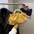 Yellow ruched cloud bag with pearl handle and leather strap for crossbody wear - Gold