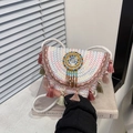 Woven bohemian saddle bag with colorful tassels and ethnic beaded disc ornament - Pink