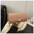 Close-up of pink stone pattern handbag featuring a gold square buckle and chain strap - Pink