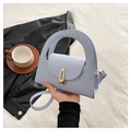 Light blue faux leather handbag with gold trapezoid buckle and round handle for women - Blue