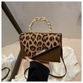 Leopard print patchwork handbag with a golden snake-shaped handle and brown leather - Brown