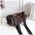 Minimalist brown cylindrical crossbody bag with wide black strap and frosted texture - Small Brown