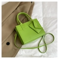 Detail of green PU leather handbag with matching mini envelope pouch and long strap - Green
